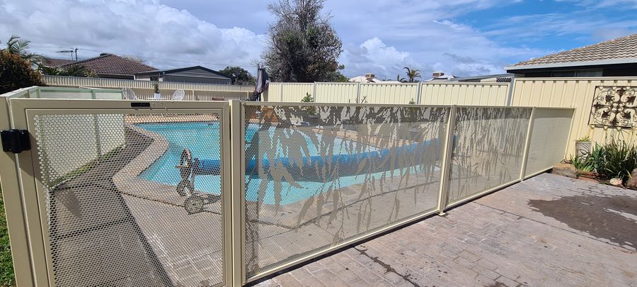 Gum design perforated pool fencing in Textured Primrose around an Adelaide backyard pool